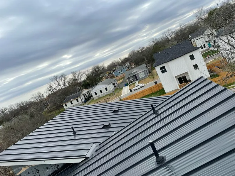 Standing seam metal roof panels with vents for Skylight Repair in Waynesville